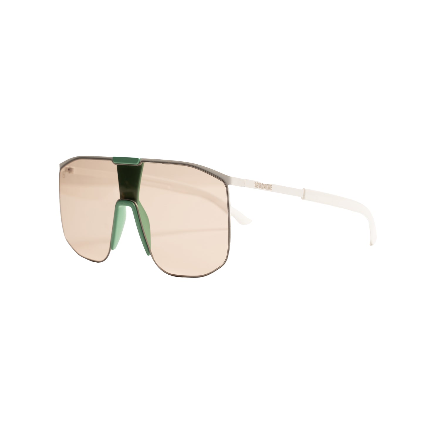 oversized shield sunglasses with emerald green bridge and blush tinted single shield lens.