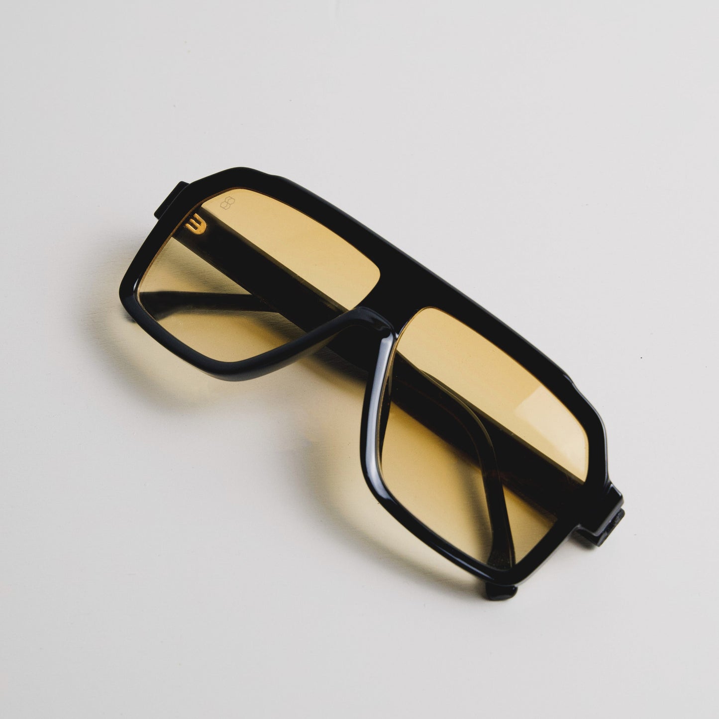 1980nine Barnette sunglasses with black thick frame and gradient yellow tinted lens.
