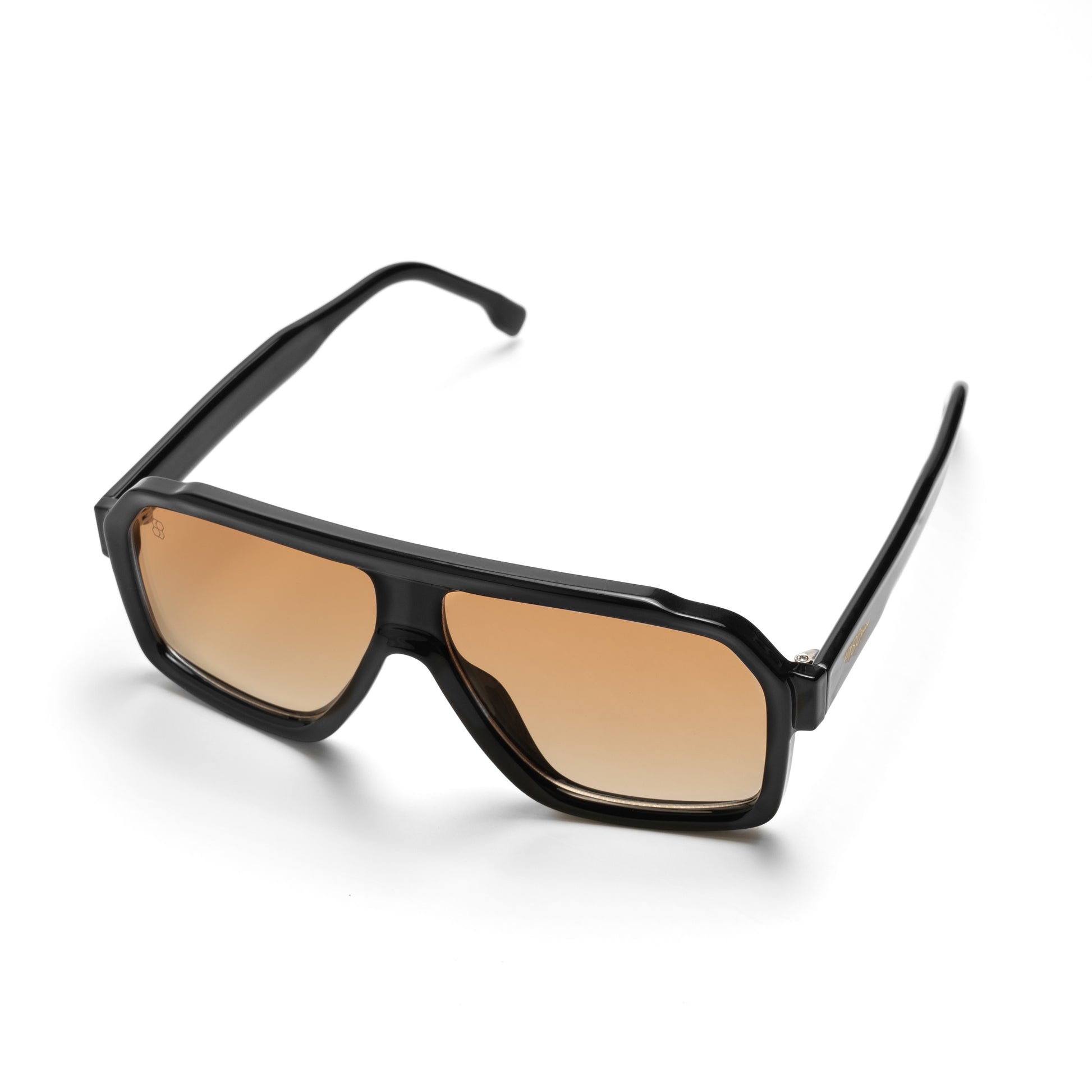 Oversized square sunglasses with thick black frame, slim arm with gold detail, and warm amber lenses viewed from side angle
