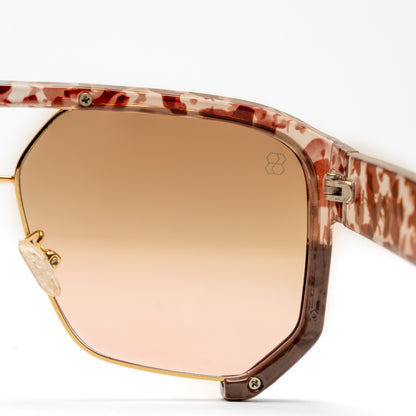 1980nine sunglasses with a leopard print frame and rose gold mirror lens on a white background