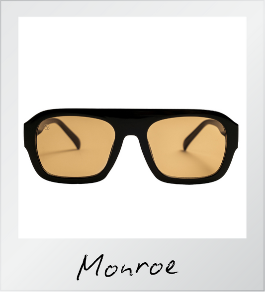 Sunglasses with brown lenses and black frame on a white background with 'Monroe' branding.