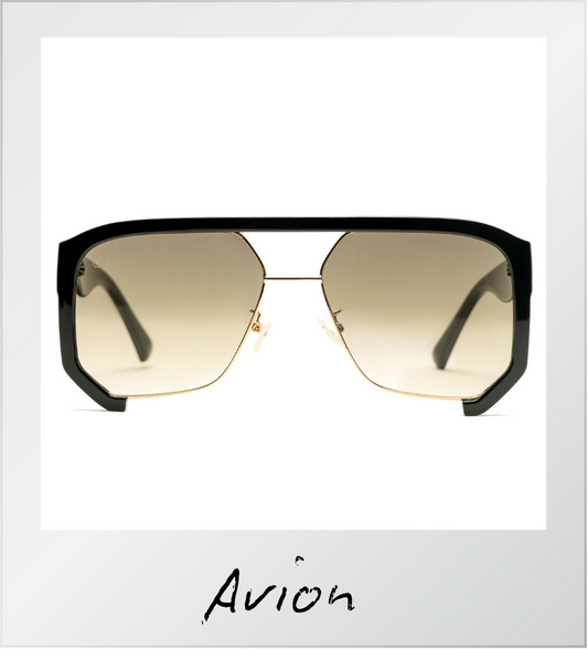 Sunglasses with gold gradient lenses and black frames on a white background with 'Avion' branding.