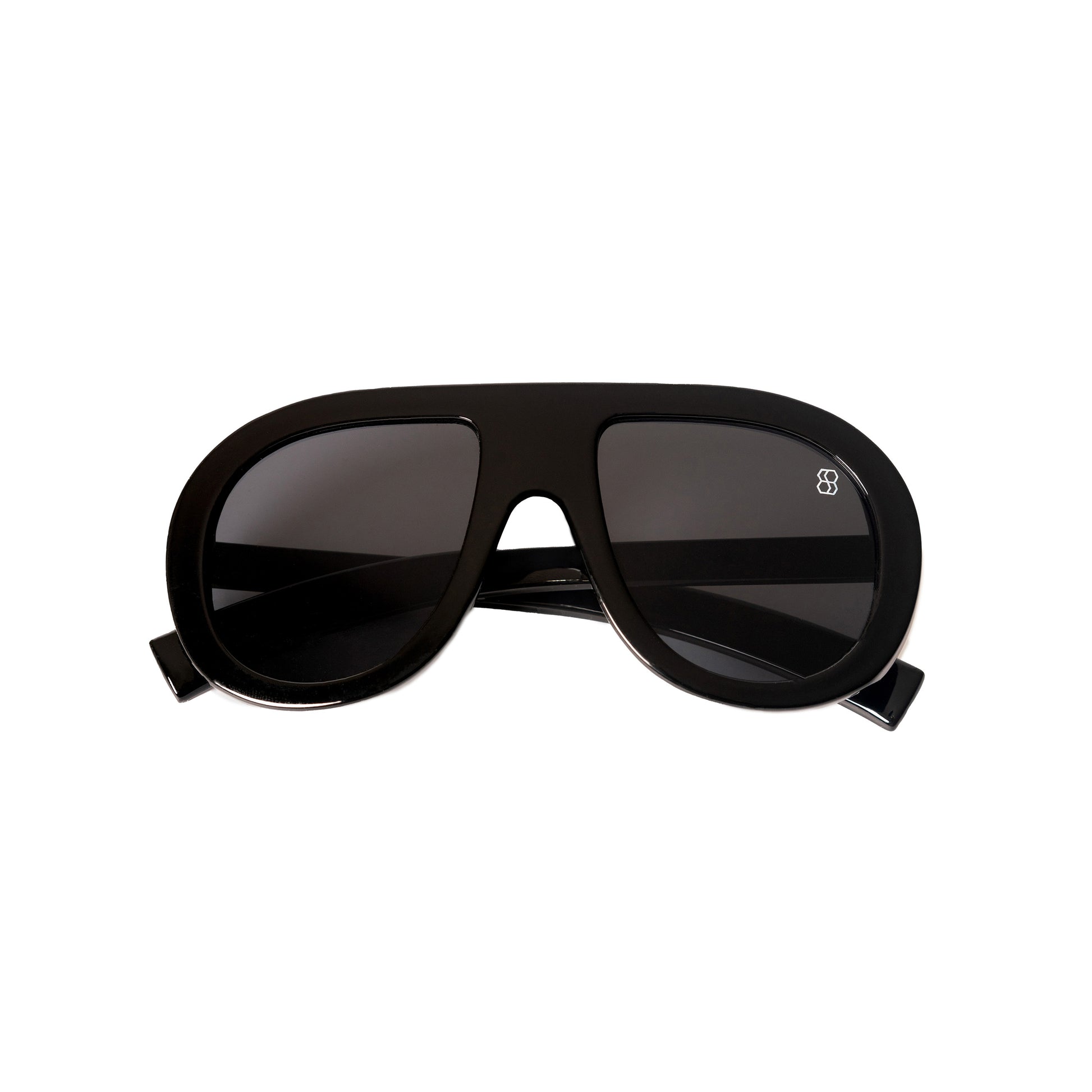 Oversized oval sunglasses with thick frames, available in green with yellow lenses, black with dark lenses, and blue with purple-tinted lenses. Wide, bold arms.