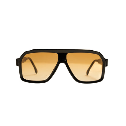 Oversized square sunglasses with thick frame and amber gradient lenses viewed from front