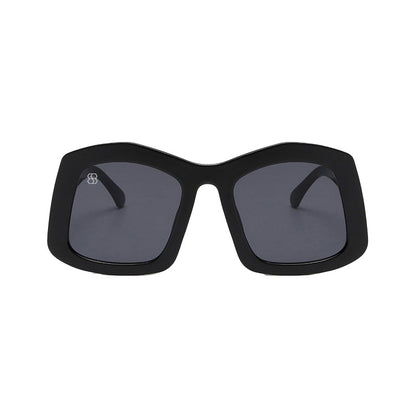 Black sunglasses with dark lenses on a white background