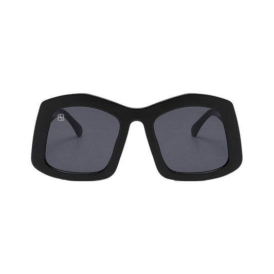 Black sunglasses with dark lenses on a white background